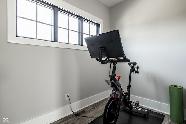 12099 Sigillary Way, Carmel, IN 46032 - workout area with baseboards and dark wood-style floors