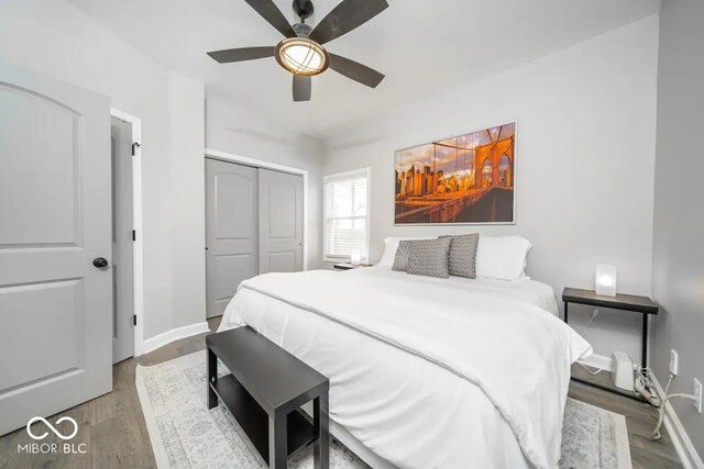 1444 English Ave, Indianapolis, IN 46201 - bedroom featuring ceiling fan, a closet, wood finished floors, and baseboards