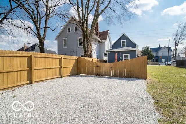 1444 English Ave, Indianapolis, IN 46201 - view of yard featuring a residential view and fence