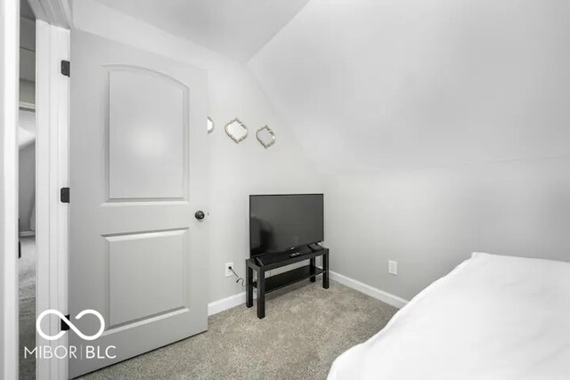 1444 English Ave, Indianapolis, IN 46201 - bedroom featuring carpet floors, baseboards, and vaulted ceiling