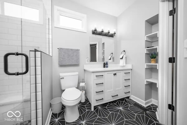 1444 English Ave, Indianapolis, IN 46201 - bathroom featuring a shower stall, vanity, baseboards, and toilet