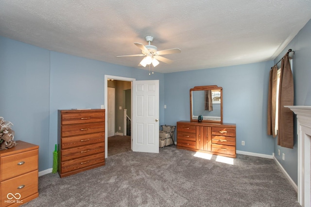 251 Howard Rd, Greenwood, IN 46142 - bedroom featuring a ceiling fan, baseboards, dark carpet, and a textured ceiling