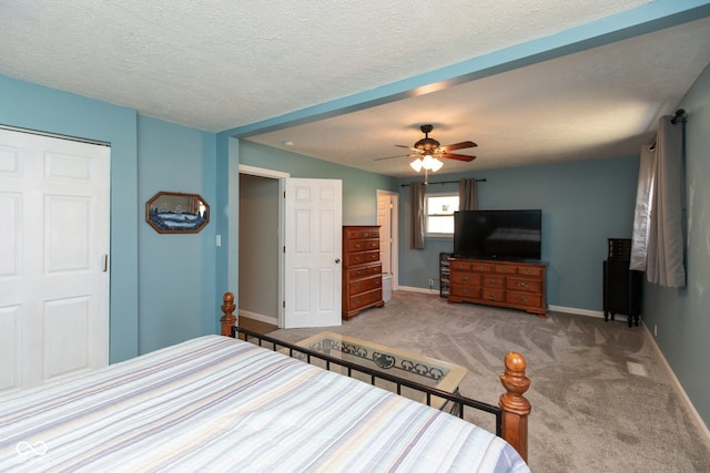 251 Howard Rd, Greenwood, IN 46142 - unfurnished bedroom with carpet flooring, a ceiling fan, baseboards, and a textured ceiling