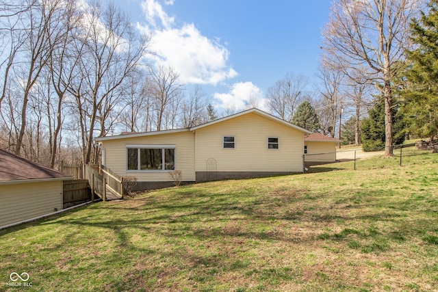 251 Howard Rd, Greenwood, IN 46142 - rear view of property featuring fence and a yard