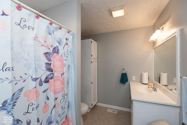 251 Howard Rd, Greenwood, IN 46142 - bathroom featuring toilet, vanity, tile patterned flooring, baseboards, and visible vents