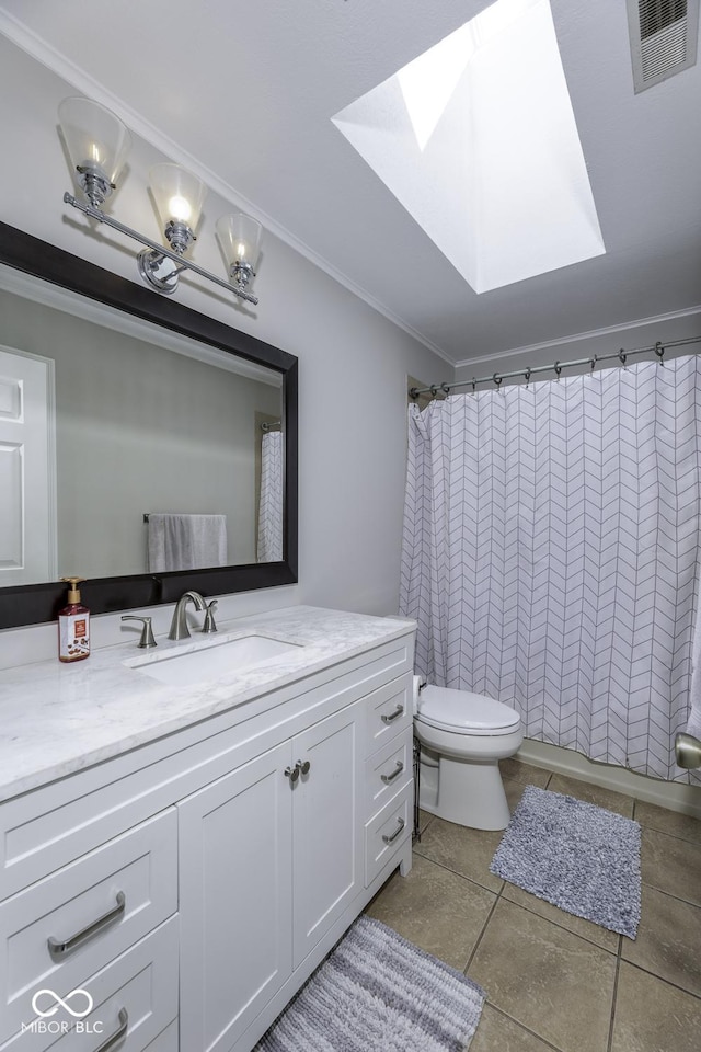 full bath with vanity, toilet, ornamental molding, a skylight, and visible vents