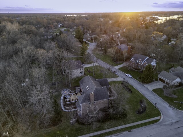 bird's eye view featuring a wooded view
