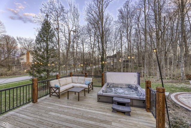 wooden terrace featuring an outdoor hangout area and a hot tub