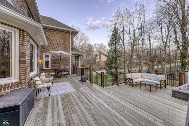 wooden deck featuring outdoor lounge area and outdoor dining space