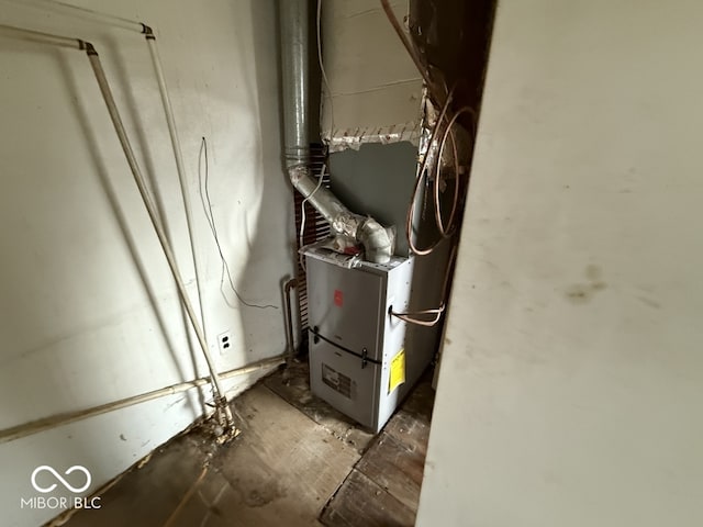 utility room with heating unit