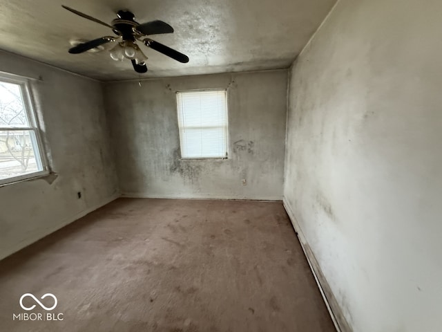 unfurnished room with a ceiling fan