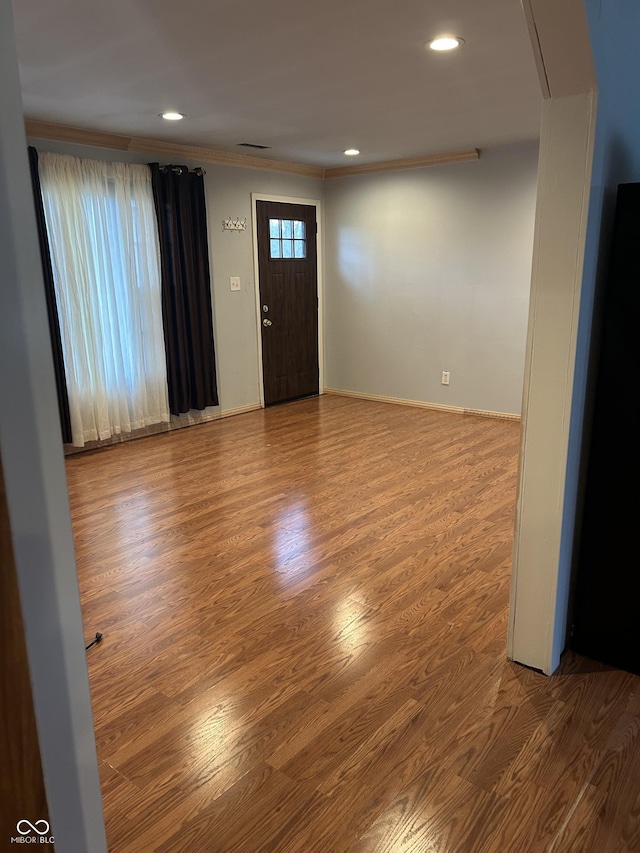 3817 N Sheridan Ave, Indianapolis, IN 46226 - entrance foyer featuring recessed lighting, crown molding, baseboards, and wood finished floors