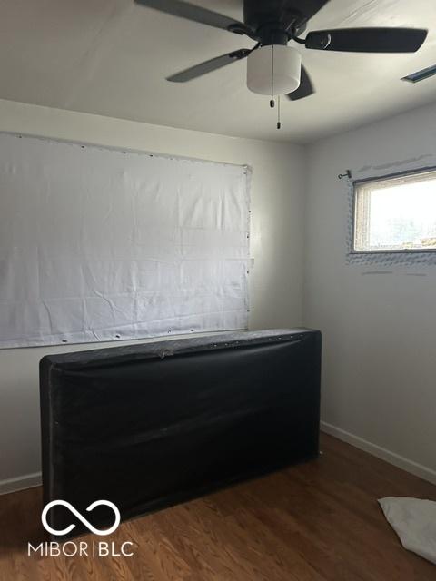 3817 N Sheridan Ave, Indianapolis, IN 46226 - unfurnished bedroom featuring baseboards, visible vents, ceiling fan, and wood finished floors