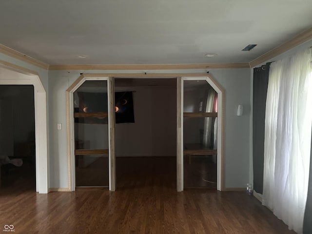 3817 N Sheridan Ave, Indianapolis, IN 46226 - empty room featuring ornamental molding, baseboards, and wood finished floors