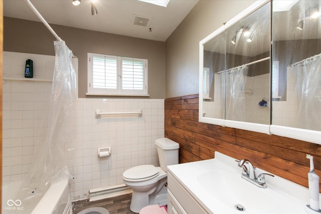 817 Shadowlawn Ave, Greencastle, IN 46135 - bathroom with visible vents, toilet, tile walls, shower / tub combo with curtain, and vanity