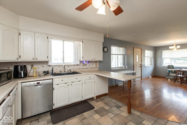 817 Shadowlawn Ave, Greencastle, IN 46135 - kitchen with a sink, light countertops, white cabinets, and appliances with stainless steel finishes