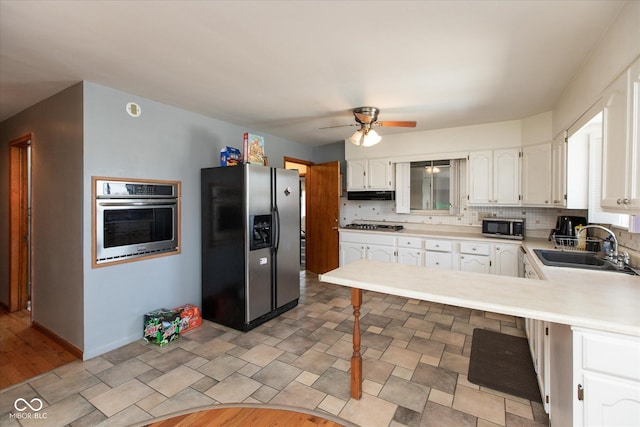 817 Shadowlawn Ave, Greencastle, IN 46135 - kitchen with stainless steel appliances, white cabinets, a sink, and ceiling fan