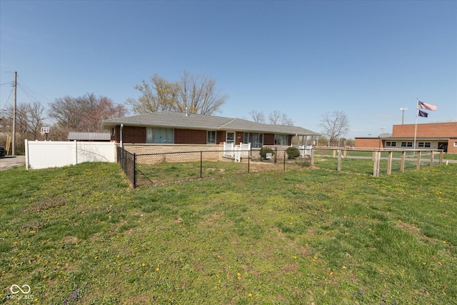 817 Shadowlawn Ave, Greencastle, IN 46135 - rear view of property featuring brick siding, a fenced backyard, and a lawn