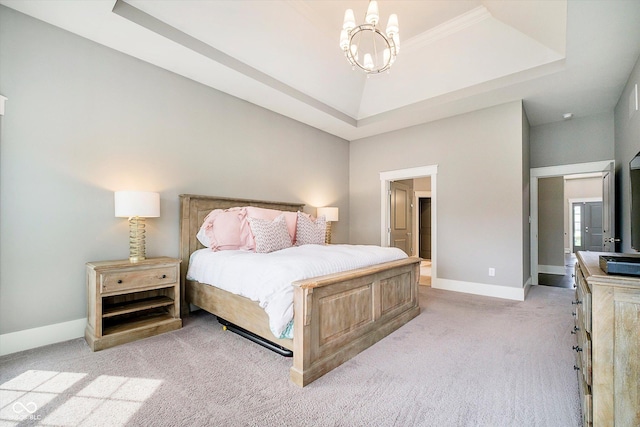 bedroom with light colored carpet, baseboards, an inviting chandelier, and a raised ceiling