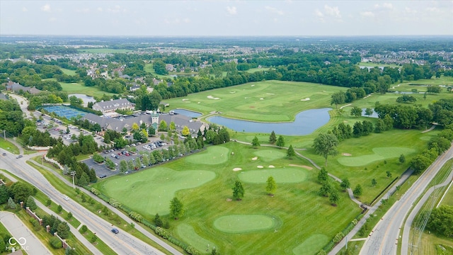 aerial view featuring golf course view and a water view