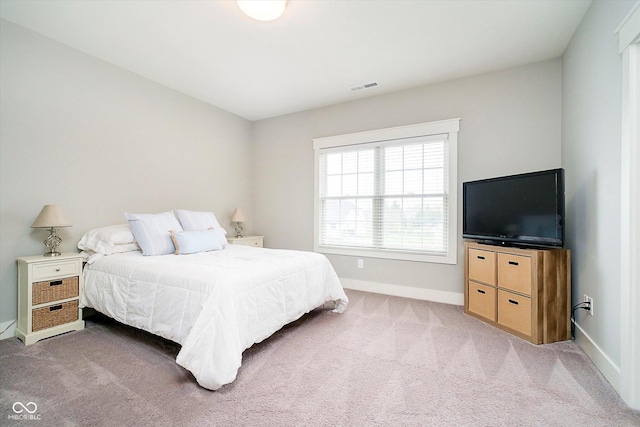 bedroom featuring baseboards, visible vents, and carpet floors