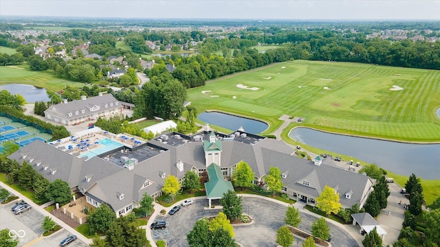 aerial view with view of golf course and a water view