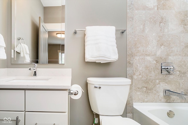 bathroom with toilet and vanity