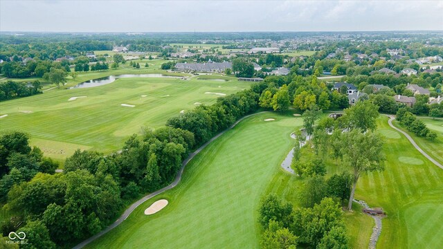 aerial view featuring a water view and golf course view