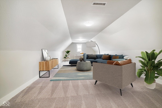carpeted living area featuring vaulted ceiling, visible vents, and baseboards