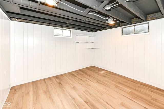 below grade area featuring light wood-type flooring