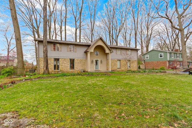 4140 Melbourne Rd, Indianapolis, IN 46228 - view of front of house featuring stone siding, a front yard, and fence