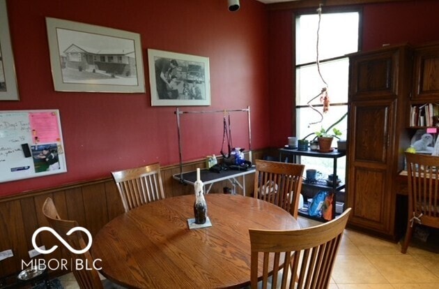 dining room featuring light tile patterned floors and a healthy amount of sunlight