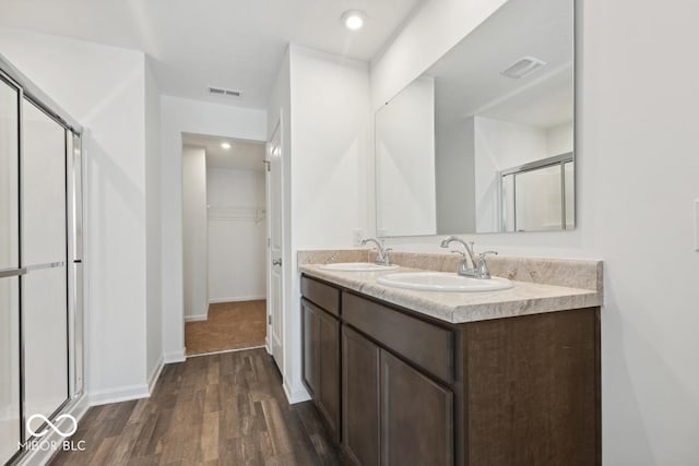 1924 White Oak Dr, Shelbyville, IN 46176 - full bathroom featuring visible vents, a sink, and a shower stall