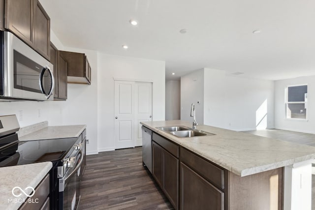 1924 White Oak Dr, Shelbyville, IN 46176 - kitchen with stainless steel appliances, a kitchen island with sink, dark wood-style floors, a sink, and dark brown cabinets