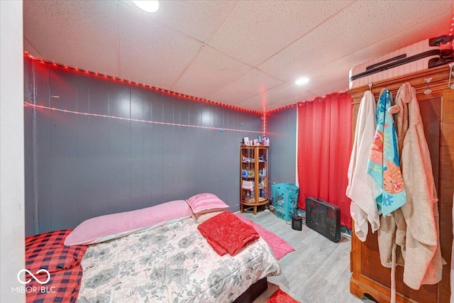 215 S Warman Ave, Indianapolis, IN 46222 - bedroom with a paneled ceiling, wood finished floors, and wooden walls