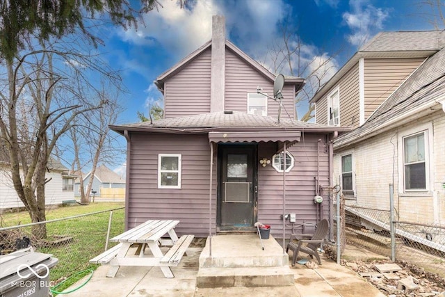 215 S Warman Ave, Indianapolis, IN 46222 - back of house featuring a patio, a shingled roof, fence, and a lawn