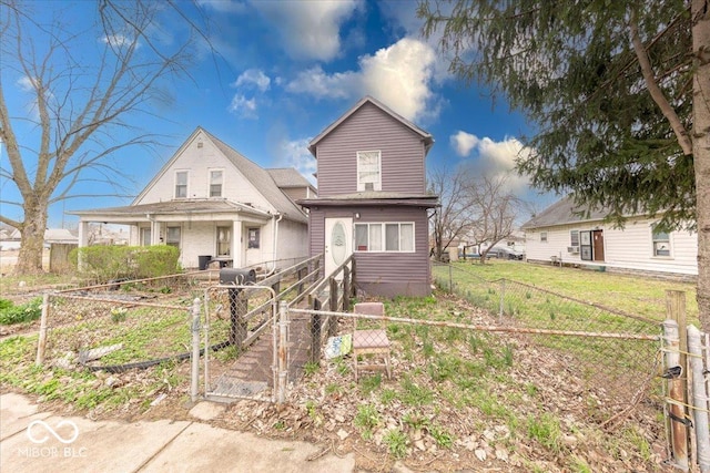 215 S Warman Ave, Indianapolis, IN 46222 - view of front facade with a gate and a fenced front yard