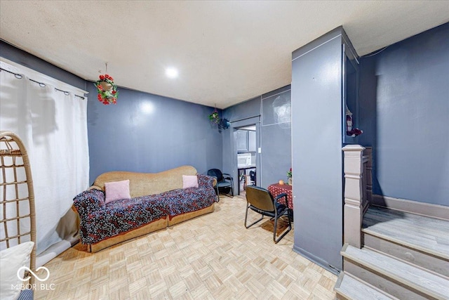 215 S Warman Ave, Indianapolis, IN 46222 - bedroom featuring a textured ceiling and baseboards