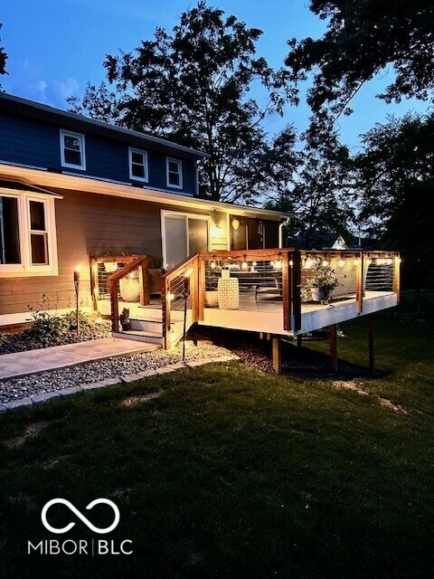 6820 W Forest Brook Dr, Fountaintown, IN 46130 - back of house featuring a deck and a lawn