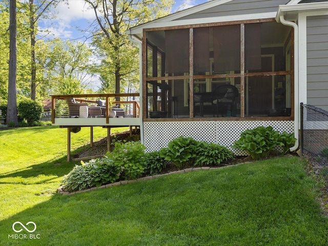 6820 W Forest Brook Dr, Fountaintown, IN 46130 - view of side of property with a sunroom, a lawn, and a deck