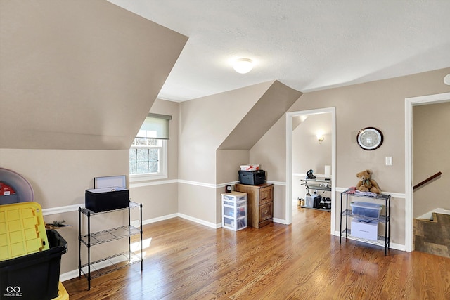 6820 W Forest Brook Dr, Fountaintown, IN 46130 - additional living space featuring wood finished floors, lofted ceiling, and baseboards