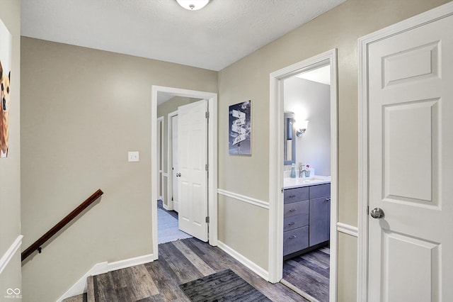 6820 W Forest Brook Dr, Fountaintown, IN 46130 - hall with an upstairs landing, dark wood finished floors, and baseboards