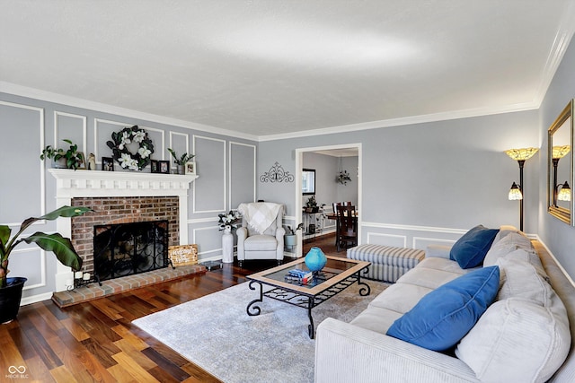 6820 W Forest Brook Dr, Fountaintown, IN 46130 - living room with a decorative wall, ornamental molding, wood finished floors, and a fireplace