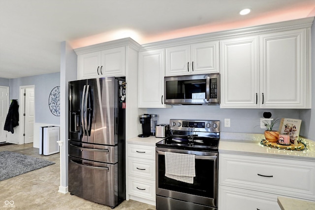 6820 W Forest Brook Dr, Fountaintown, IN 46130 - kitchen featuring stainless steel appliances, light countertops, white cabinets, and recessed lighting