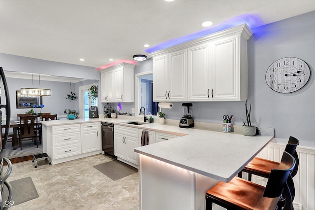 6820 W Forest Brook Dr, Fountaintown, IN 46130 - kitchen featuring a peninsula, a sink, light countertops, dishwasher, and recessed lighting