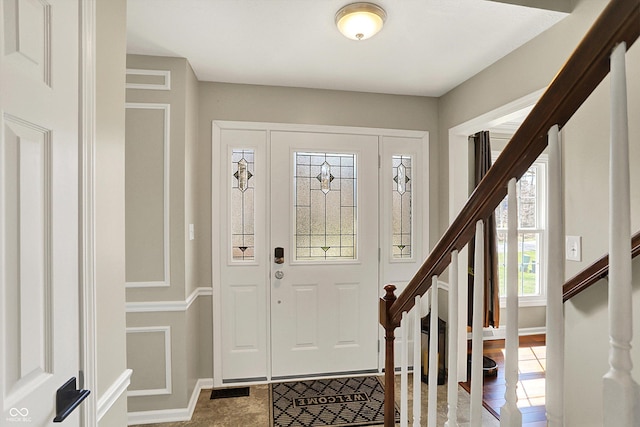 6820 W Forest Brook Dr, Fountaintown, IN 46130 - foyer entrance featuring stairway and baseboards
