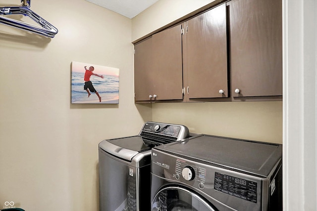 6820 W Forest Brook Dr, Fountaintown, IN 46130 - laundry area featuring cabinet space and washer and clothes dryer