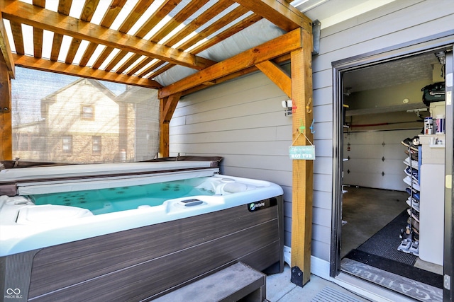 6820 W Forest Brook Dr, Fountaintown, IN 46130 - view of patio / terrace with a hot tub and a pergola