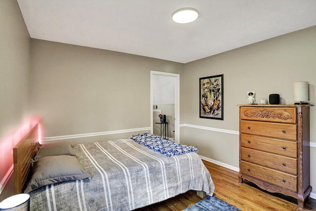 6820 W Forest Brook Dr, Fountaintown, IN 46130 - bedroom featuring wood finished floors and baseboards