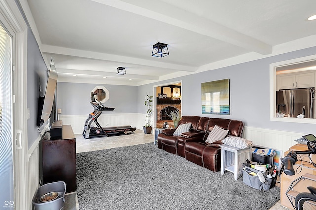 6820 W Forest Brook Dr, Fountaintown, IN 46130 - carpeted living room with a wainscoted wall, beam ceiling, and recessed lighting